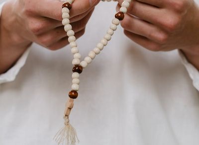 Close-up of hands in a meditative gesture.